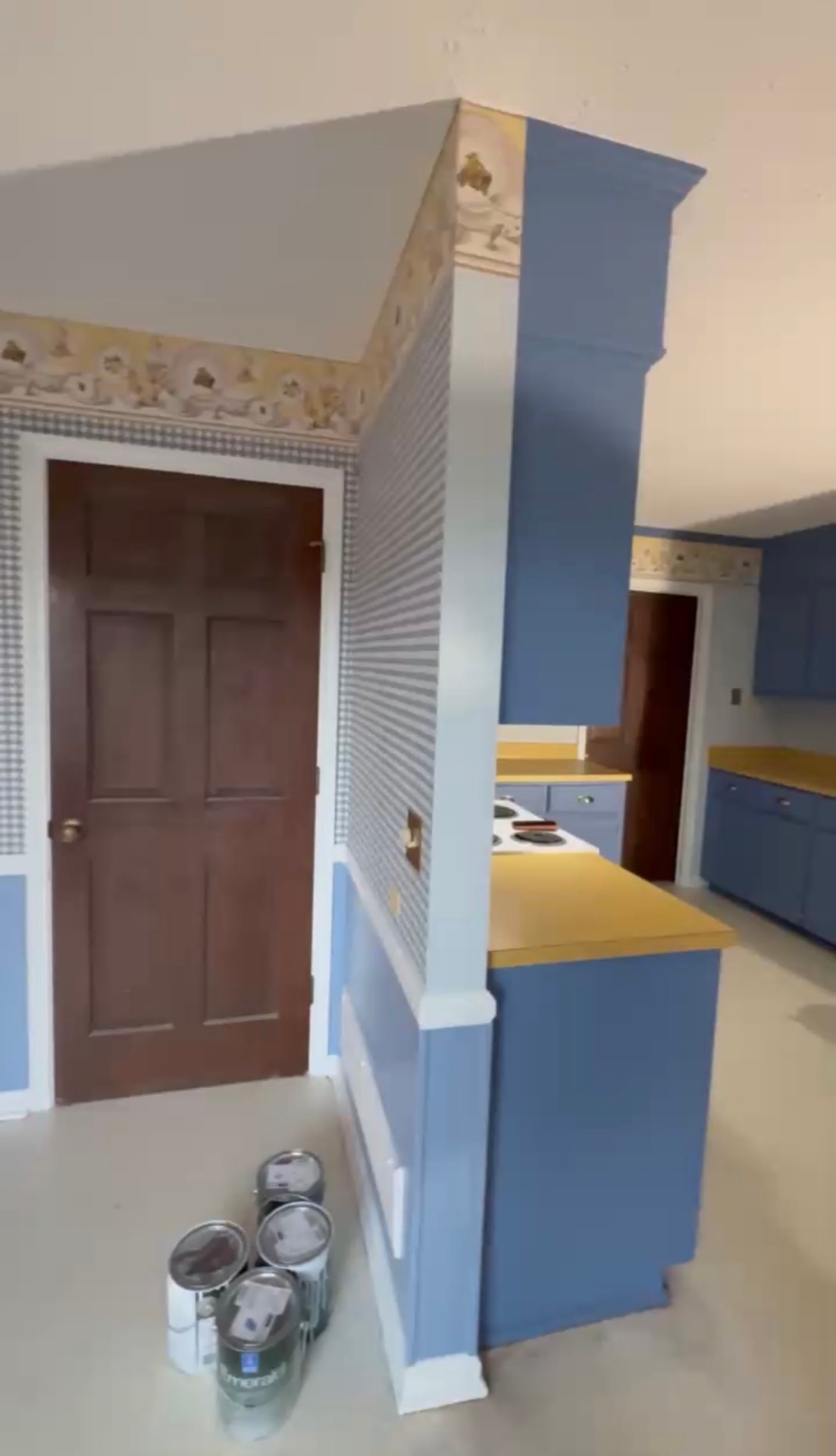 Second angle of refinished blue kitchen cabinets with a smooth, factory-even sprayed finish — Kitchen Cabinet Refinish in Deep Blue in Lexington, SC